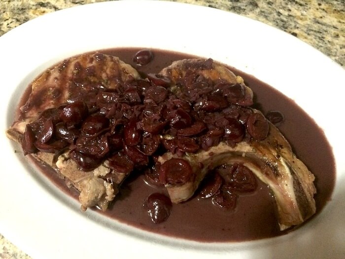 Pork Chops Served With Cherry And Ginger Sauce Pork Chops Served With Cherry And Ginger Sauce