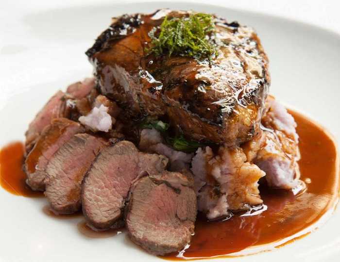 Roasted Lamb In Red Wine And Served With Italian Beans